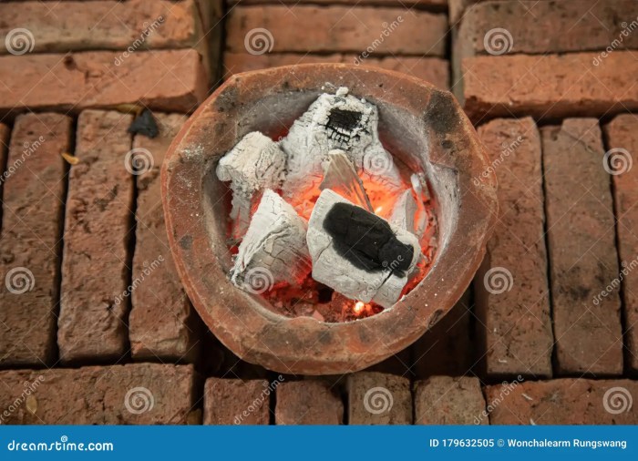 Charcoal stove cooking traditional stock