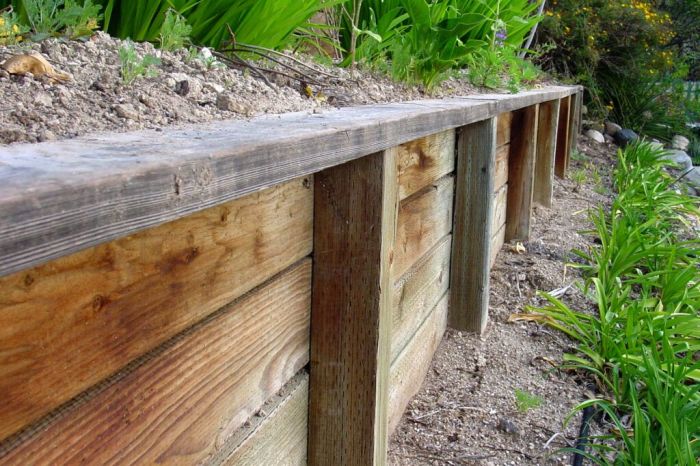 Retaining wall wooden walkway landscape stabilizing larger